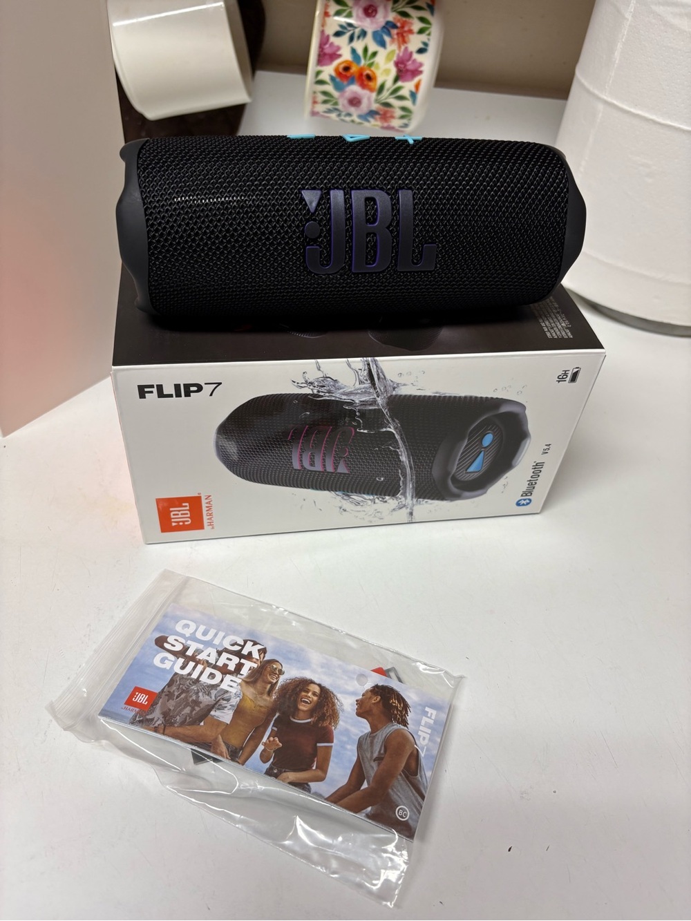 NEW NEVER USED JBL Flip 7 Portable Bluetooth Speaker - Black with Blue Buttons